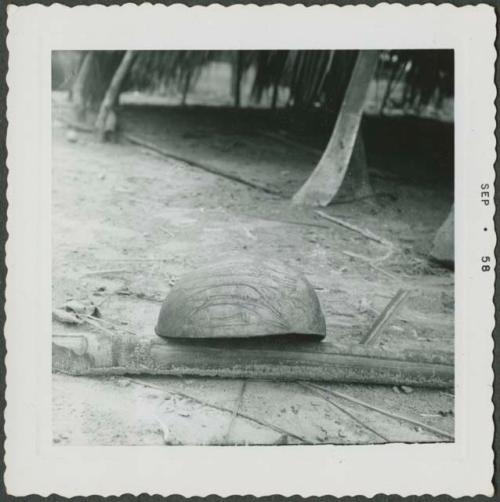 Photograph album, Yaruro fieldwork, p. 60, photo 5, decorated object leaning on stick