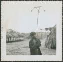 Photograph album, Yaruro fieldwork, p. 63, photo 1, boy standing in yard