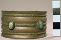 Navajo silver bracelet. Four pieces of turquoise set on bracelet. 6.8x5.1 cm.