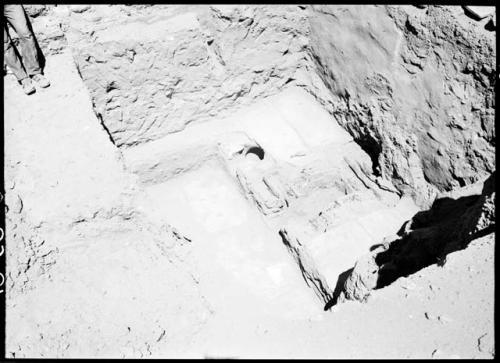 Awatovi, Room 529, S. end, showing ventilator shaft and pot set under bench, with covering slabs removed.