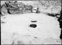 Site 107, Room 1, showing firepit and ventilator shaft, looking east.