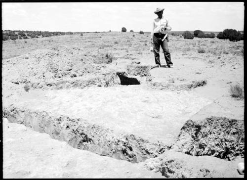 Site 107, adobe level of Room 6, showing cist at E. end.