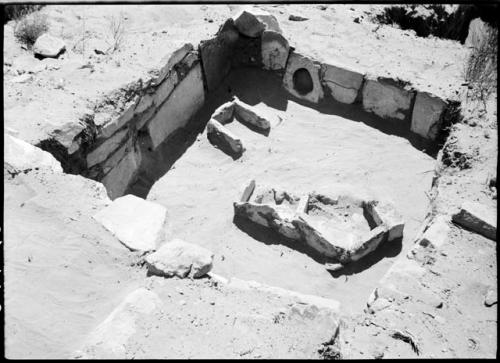 Site 108, Room 3, looking east.  Shows multiple firepits and a special hole on one of the wall slabs.