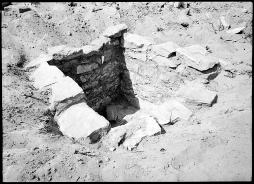 Site 105, Room 2, showing interior walls and exterior finishing, looking east.