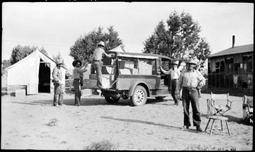 Hopi men loading the Dodge truck, with Happy and Al