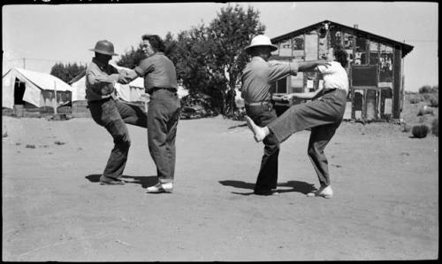 John Hack and Haych, Carlos and Evelyn, dancing.