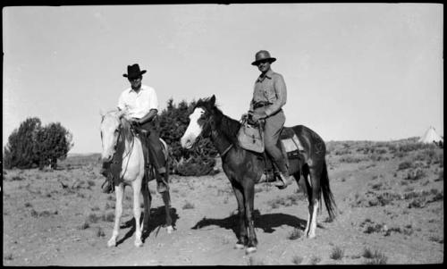 Bill and Johnny on horseback.