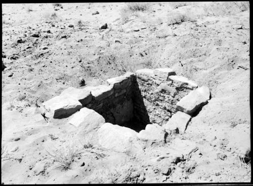 Site 105, Room 2, looking NW, showing interior masonry and exterior wall finishing subterranean kiva or room.