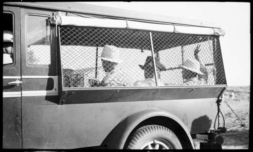 Mott Davis, Bill Claflin, Carlos Garcia Robion in truck.