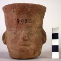 Drinking cup, human face