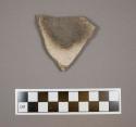 Body sherd from a bowl, interior slipped white