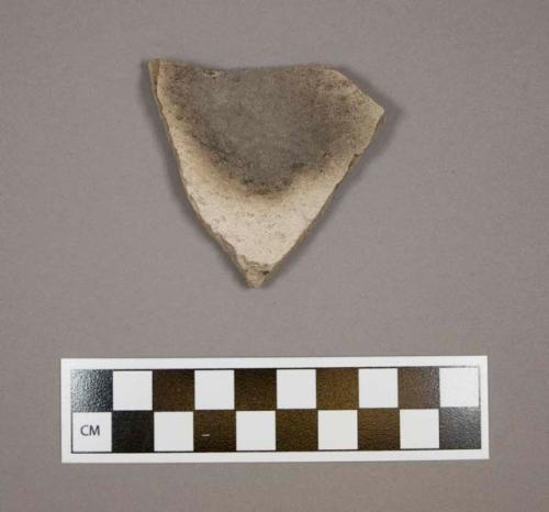 Body sherd from a bowl, interior slipped white