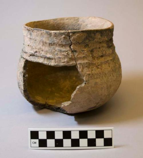 Ceramic jar, body sherds missing, banded neck, corrugated shoulder