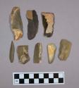 Flint blades; retouched; some points; six with cortex; brown and tan-colored stone