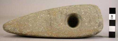 Stone axe, not perforated (unfinished); shows drilling from both sides