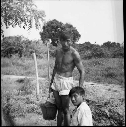 Economic life/Arts and crafts: man with bucket