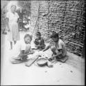 Economic life/Arts and crafts: children around bowl