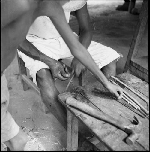 Economic life/Arts and crafts: close view of Yaruro working at construction table