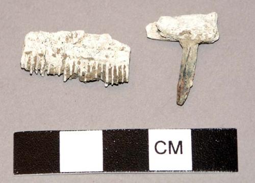 Fragments of bone comb, with back reinforced by iron pins