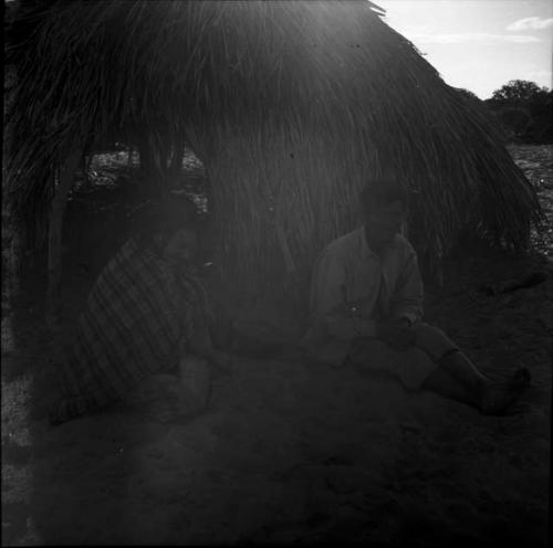 Portraits of people: man sitting outdoors on the ground