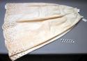 Cotton skirt (white) with lacy cutwork design around the hem.
