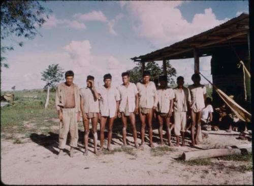 Group photograph of men standing in row