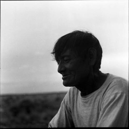 Portraits of people: smiling man in white shirt