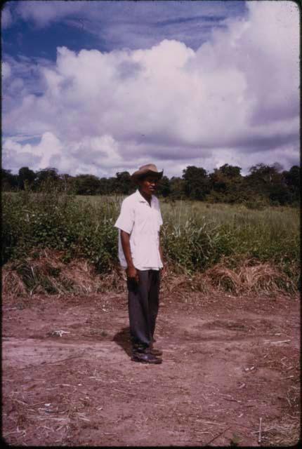 Man wearing white shirt and hat