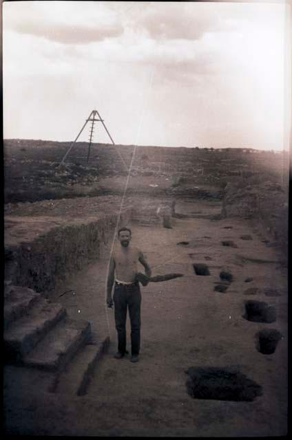 Someone, probably Dick Wheeler, standing in nave beside steps; tripod in rear