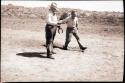 Jo and Watson pitching horseshoes