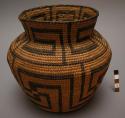 Bottle-necked basket, coiled. Geometric designs.