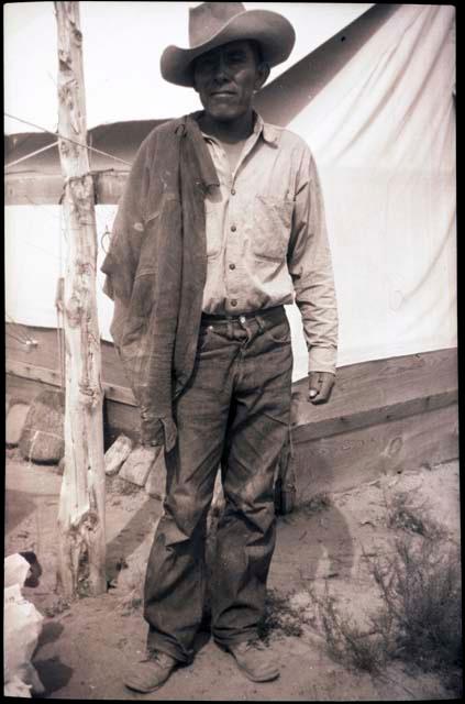 Gibson Namoki standing in front of tent