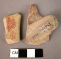 2 potsherds - red slipped and burnished