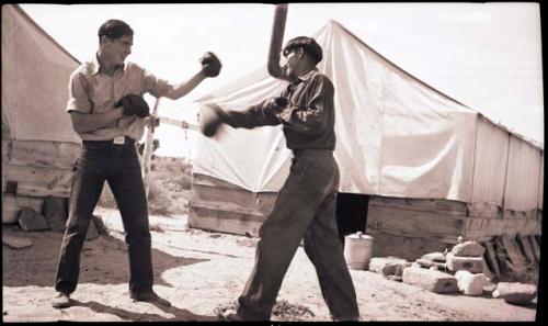 Happy Foote boxing with another man, probably Everett Harris