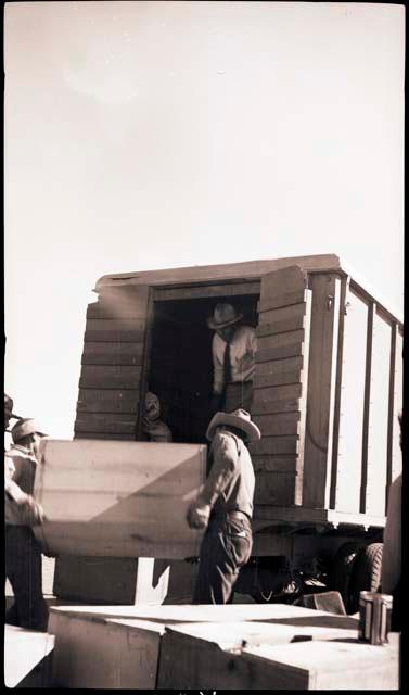 Loading truck with crates