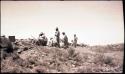 Hopi men excavating at the site