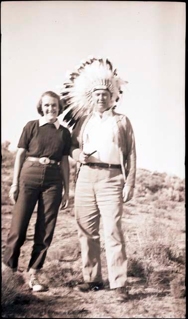 Ken Disher in war bonnet with his wife, Connie