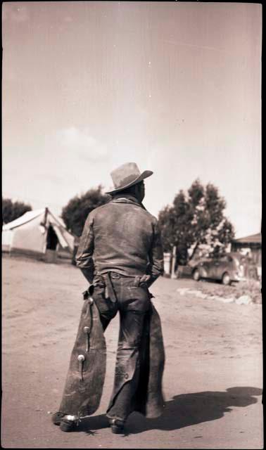 Elwood Dennis standing with his back to the camera