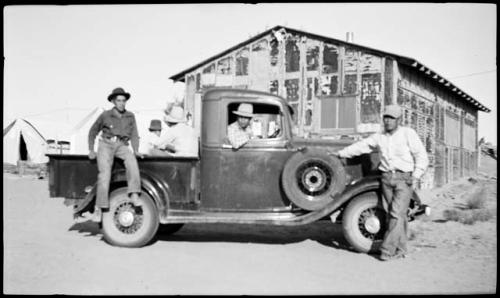 Hopi men riding in the pickup truck