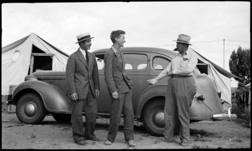 Bill Claflin and Mott Davis dressed to leave, with Jo Brew.