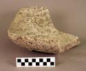 Ground stone metate fragment