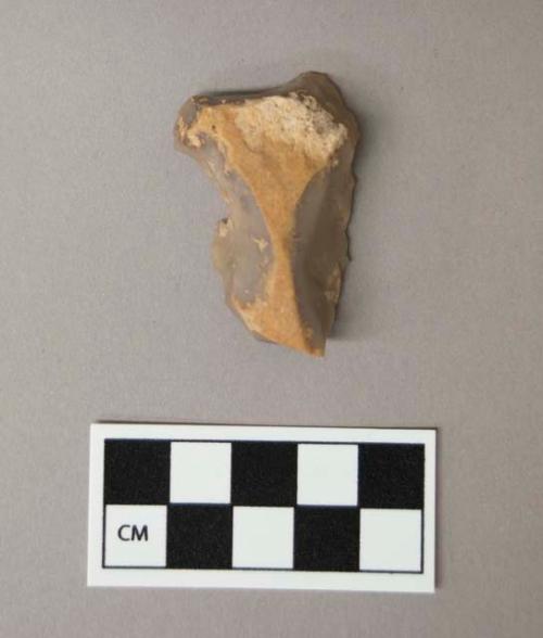 Flint burin, grey and cream colored stone, contains cortex