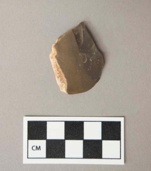Flint burin, brown colored stone, contains cortex