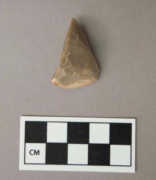 Flint burin, grey colored stone, contains cortex