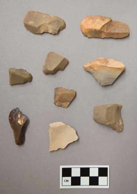 Flint scrapers, including tan, grey, brown and cream colored stone, some contain cortex