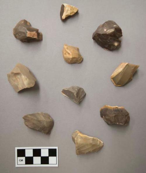 Flint scrapers, including tan, brown, grey, red and cream colored stone, some contain cortex