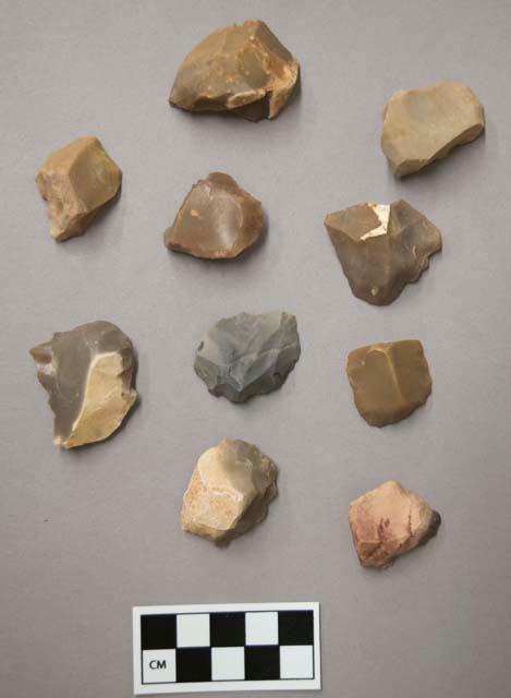 Flint scrapers, including tan, grey, brown, cream and red colored stone, some contain cortex