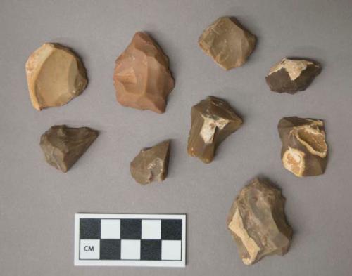 Flint scrapers, including tan, grey, brown and pink colored stone, some contain cortex