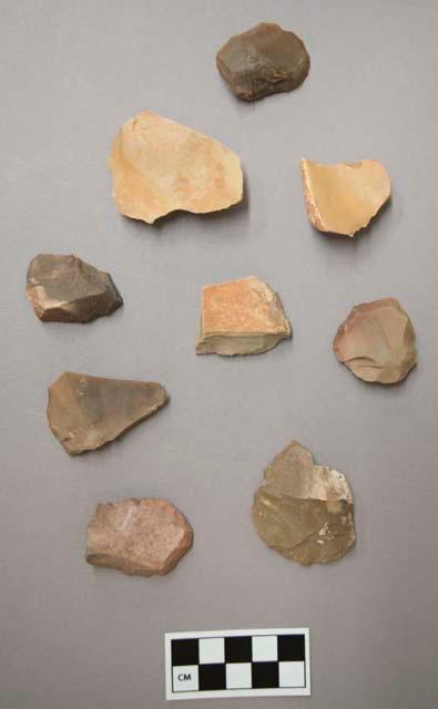 Flint scrapers, including tan, grey, brown and purple colored stone, some contain cortex