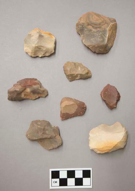 Flint scrapers, including tan, grey, brown, red and purple colored stone, some contain cortex